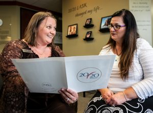 A team member is explaining to the patient what to expect on the day of her procedure at Elite LASIK & Cataract in Indianapolis.